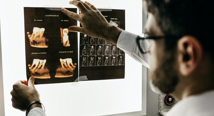 A dentist assessing a patients teeth
