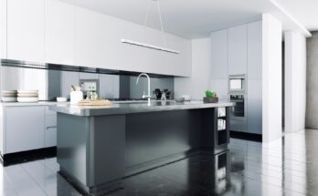 A modern kitchen island with sleek marble worktop, brass hardware, and pendant lighting above, featuring built-in kitchen cabinets for storage and comfortable bar stools for casual dining. The island is set in an open-plan kitchen with ample counter space and a harmonious colour scheme, creating a central hub for cooking, dining, and socializing.