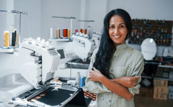 Worker operating embroidery machine — How to Get the Best Rate on Custom Embroidery